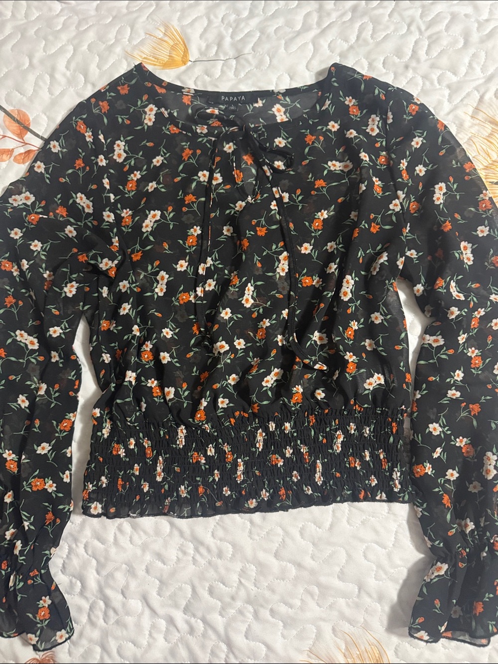 Sheer black floral blouse